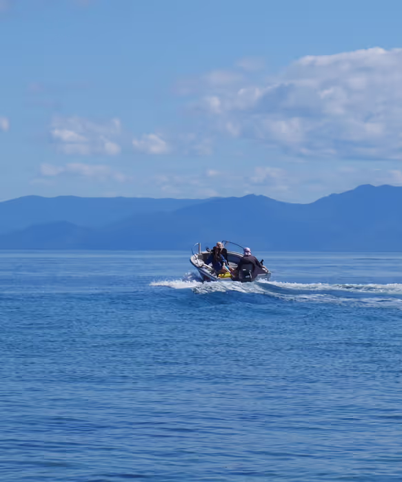 A speedboat on bright blue water.